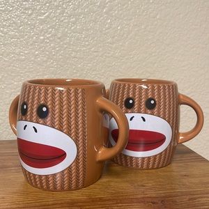 A set of 2 Gallerie: Double Handle Monkey Mugs